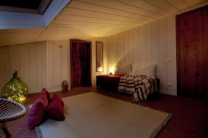A bed or beds in a room at Lo Speziale - Corbezzolo