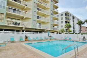a swimming pool in front of a apartment building at Water View 506 in Clearwater Beach