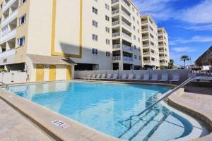 a large swimming pool in front of a building at Anglers Cove 608 in St Pete Beach