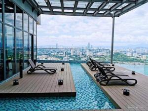 a pool on the top of a building with a view at KL Duplex with balcony@Ekocheras MRT in Kuala Lumpur