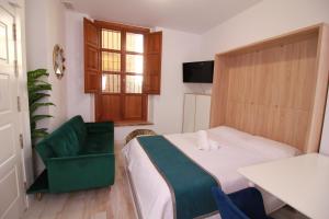Postel nebo postele na pokoji v ubytování GLORIA SUITES
