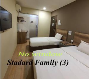 Postel nebo postele na pokoji v ubytování SH Hotel Kota Damansara