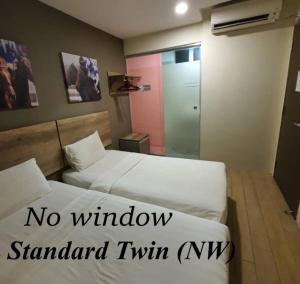 Postel nebo postele na pokoji v ubytování SH Hotel Kota Damansara
