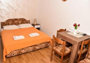 Ένα ή περισσότερα κρεβάτια σε δωμάτιο στο Apartments Simun