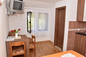 Η κουζίνα ή μικρή κουζίνα στο Apartments Simun
