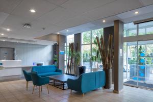 Posezení v ubytování CYAN HOTEL - Roissy Villepinte Parc des Expositions