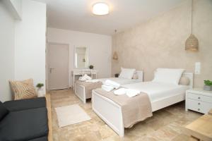 Ein Bett oder Betten in einem Zimmer der Unterkunft Horizon Hotel Kalymnos