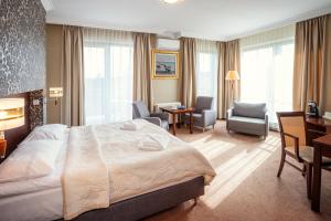 Posteľ alebo postele v izbe v ubytovaní Hotel Kuracyjny Spa & Wellness