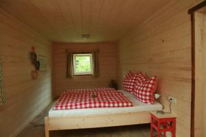 Ένα ή περισσότερα κρεβάτια σε δωμάτιο στο Ferienhaus Eckstoa