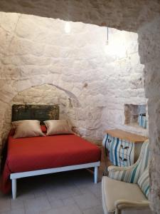 Postel nebo postele na pokoji v ubytování Trullo Nadia Ostuni + 37 fotografií
