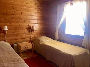 Postel nebo postele na pokoji v ubytování Lentiira Holiday Village