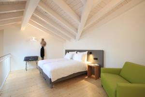 Postel nebo postele na pokoji v ubytování Charme Hotel al Torchio + 33 fotografií