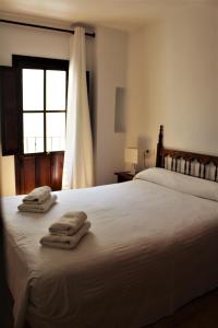 Cama o camas de una habitación en Pensión Sevillano