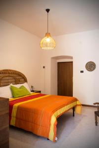 Una cama o camas en una habitación de Casa Vacanze La Piazzetta - Cascata delle Marmore
