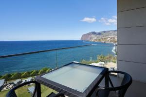 a view from a balcony of a balcony overlooking the ocean at Golden Residence Hotel in Funchal