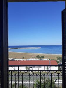 a view of the beach from a balcony at La Casa di Zorbas in Cariati