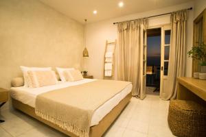 Ein Bett oder Betten in einem Zimmer der Unterkunft Horizon Hotel Kalymnos