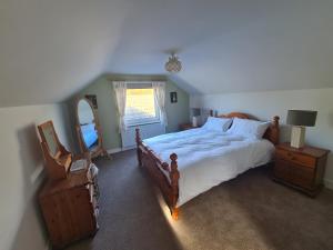 מיטה או מיטות בחדר ב-Carraig Bawn