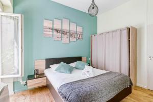 Posteľ alebo postele v izbe v ubytovaní MOANA - Petit cocon situé quartier République