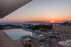 a view of the sunset from the roof of a building at Vila Aurelia 1 in Makarska