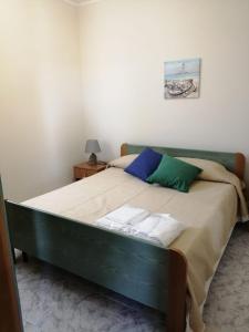 Postel nebo postele na pokoji v ubytování Casa vacanze Le Dune