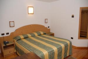 Postel nebo postele na pokoji v ubytování Hotel Sport