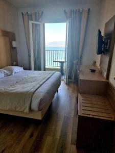 Postel nebo postele na pokoji v ubytování Hôtel U Paradisu