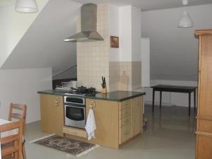 a kitchen with a stove and a counter top at Na Skarpie in Wyszków