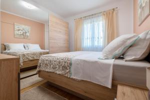 Postel nebo postele na pokoji v ubytování VRANJEŠ