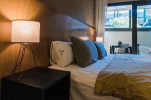 Cama ou camas em um quarto em Plaza Paradiso Petit Hotel