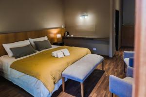 Cama ou camas em um quarto em Plaza Paradiso Petit Hotel