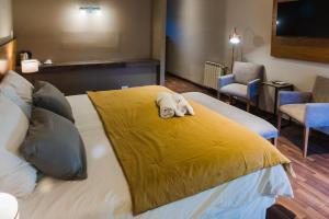 Cama ou camas em um quarto em Plaza Paradiso Petit Hotel