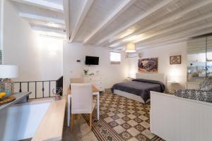Posteľ alebo postele v izbe v ubytovaní Casa Talete Cozy Apartment in Ortigia - FIRST FLOOR