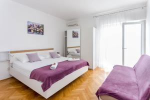 Posteľ alebo postele v izbe v ubytovaní Villa Silvana