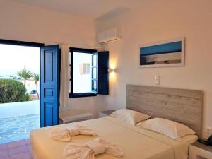 Postel nebo postele na pokoji v ubytování Aegeo Hotel