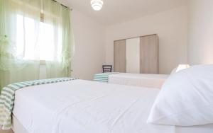 Voodi või voodid majutusasutuse Apartment Mikao - Torre Pali toas