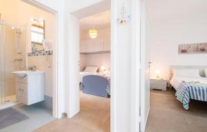 Postel nebo postele na pokoji v ubytování Apartment Mikao - Torre Pali