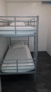 Postel nebo postele na pokoji v ubytování Pavillon Kalensa