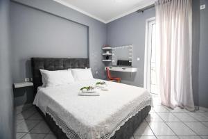 Uma cama ou camas num quarto em Joyia's Apartment