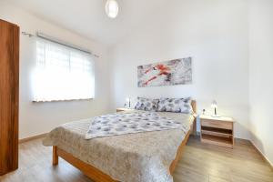 Posteľ alebo postele v izbe v ubytovaní Apartment Jaga