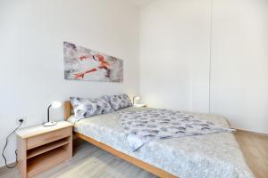 Posteľ alebo postele v izbe v ubytovaní Apartment Jaga