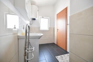 Kúpeľňa v ubytovaní Apartment Jaga