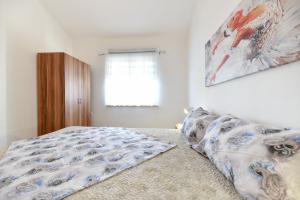 Posteľ alebo postele v izbe v ubytovaní Apartment Jaga