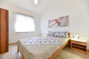 Posteľ alebo postele v izbe v ubytovaní Apartment Jaga