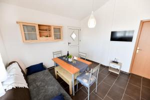 Televízia a/alebo spoločenská miestnosť v ubytovaní Apartment Jaga
