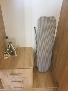a radiator sitting in a corner of a room at blue - comfy center rodos in Asgourou +18 photos