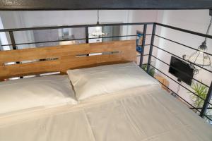 Posteľ alebo postele v izbe v ubytovaní Villanova Loft