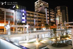 a view of a city at night with buildings at Hotel Initial-Beer in Tainan