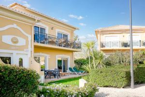 a villa with a view of the house at WOW Flat, Birdie, Golf, Spa & Swimming Pool (WIFI) in Lagos