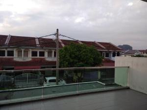 a view of a building from the balcony of a house at Fong's Ipoh SImpang Pulai Homestay in Ipoh